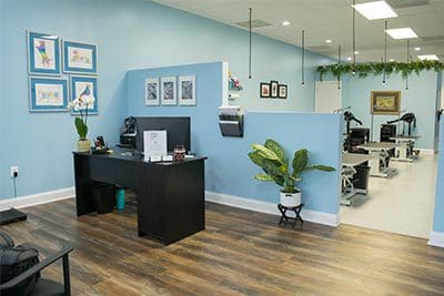 A room with blue walls and wooden floors.